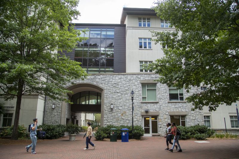 People walk past Longstreet-Means Hall on the Emory University campus in Atlanta, Tuesday, June 29, 2021. Emory University will change the name of the building to Eagle Hall. (Alyssa Pointer / Alyssa.Pointer@ajc.com)

