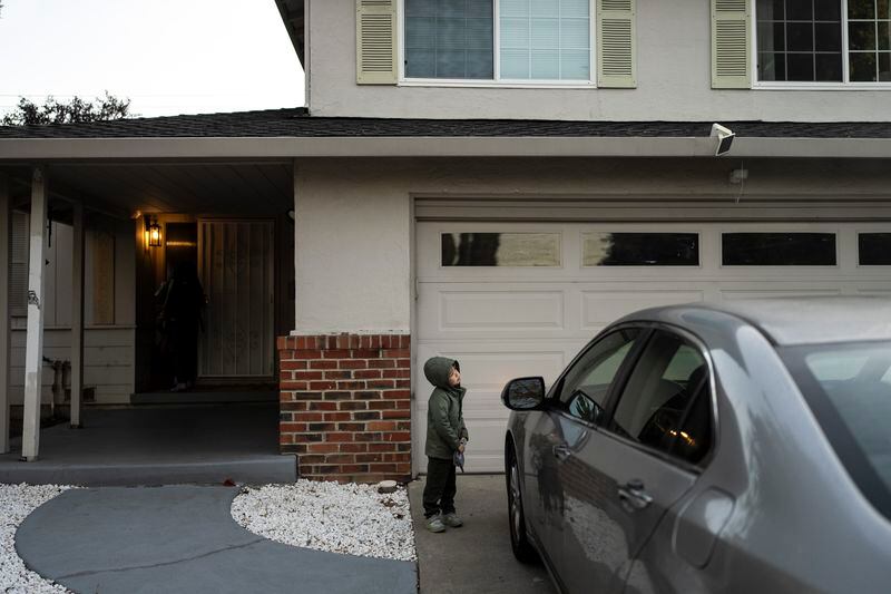 Four-year-old Ethan Quinn leaves home for his daycare center in Concord, Calif., Wednesday, Nov. 1, 2023. Ethan's parents opted to keep him in a private daycare center instead of enrolling him in “transitional kindergarten” — a program offered for free by California elementary schools for some 4-year-olds. (AP Photo/Jae C. Hong)