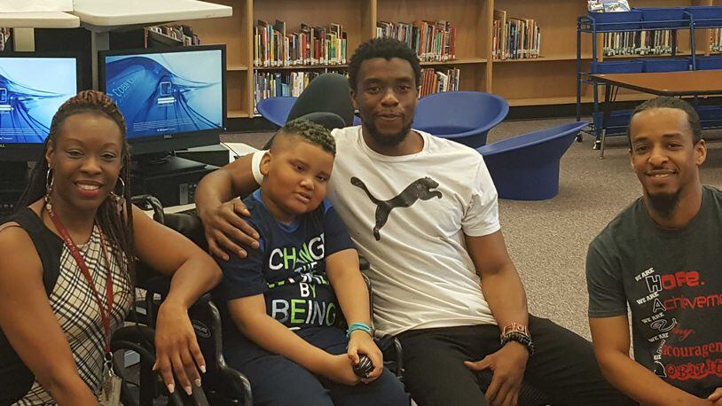 Chadwick Boseman, star of the upcoming "Black Panther" Marvel movie franchise, made a surprise visit to a Cobb County student-fan. Left to right: teacher Alisha Smith, student Ian Hopgood, Boseman and paraprofessional Kendrick Love.