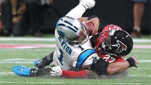 Atlanta Falcons safety Damontae Kazee levels Carolina Panthers quarterback Cam Newton and is ejected from the game during the second quarter on Sunday, Sept. 16, 2018, at Mercedes-Benz Stadium in Atlanta.