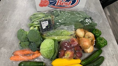 Each package distributed Friday will include 20 pounds of fruits and vegetables and 10 pounds of frozen chicken, officials said. SPECIAL PHOTO / DEKALB COUNTY