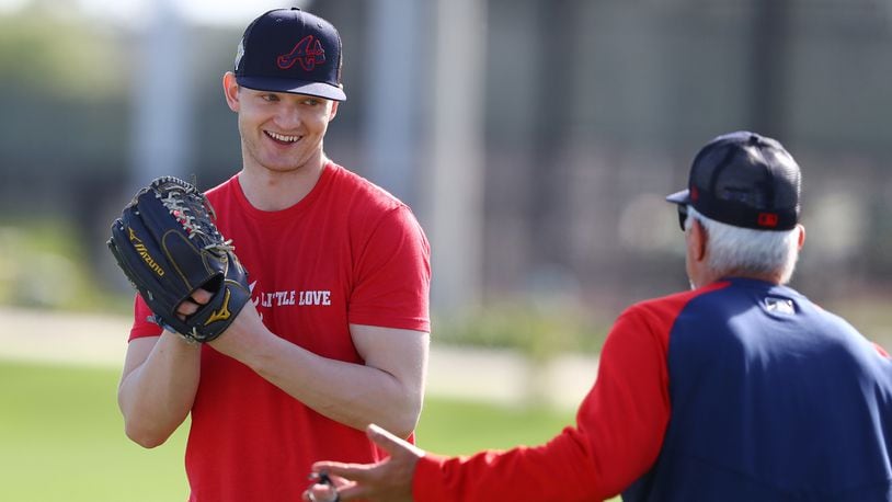 Atlanta Braves injured pitcher Mike Soroka, recovering from a Achilles tendon tear, works with pitching coach Rick Kranitz the first day of team practice at Spring Training on Monday, March 14, 2022, in North Port.  Curtis Compton / Curtis.Compton@ajc.com