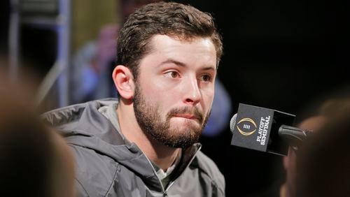 12/30/17 - Los Angeles - A tired looking Baker Mayfield answers questions during his teams media appearance this morning.  Oklahoma quarterback Baker Mayfield participated in team media day activities today after arriving late to the event.   He reportedly has been  recovering from the flu over Christmas break. He missed the trip to Disneyland on Wednesday with the illness and another event on Friday.   Oklahoma plays Georgia in a NCAA semifinal playoff game at the Rose Bowl on Monday.  BOB ANDRES  /BANDRES@AJC.COM