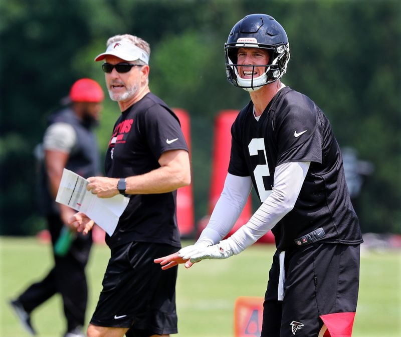 Falcons offensive coordinator Dirk Koetter and quarterback Matt Ryan go through their paces during an offseason practice in 2019. (Curtis Compton/ccompton@ajc.com)