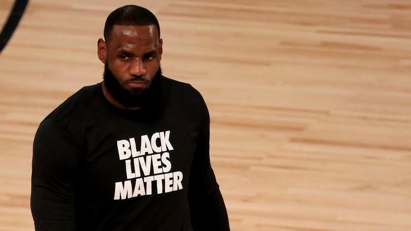 Los Angeles Lakers' LeBron James wears a Black Lives Matter shirt as he takes to the court prior to game against the Los Angeles Clippers in 2020 (Mike Ehrmann/AP)