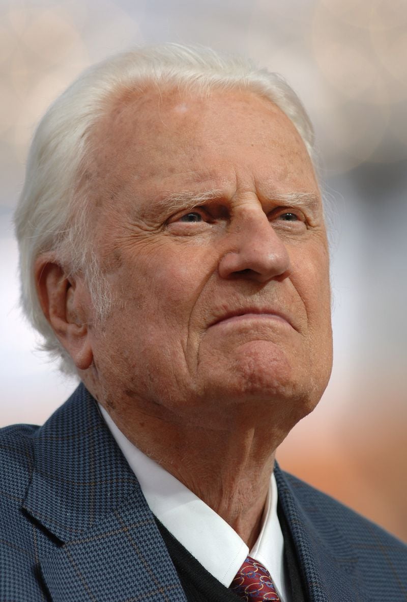 Evangelist Billy Graham pauses while delivering a sermon during the Metro Maryland Festival in this July 9, 2006 file photo in Baltimore. (AP Photo/Gail Burton, file).