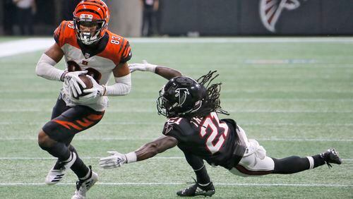 Atlanta Falcons defensive back Desmond Trufant (21) can't stop Cincinnati Bengals wide receiver Tyler Boyd (83) on 4th and 6 as he gains 7 yards on a pass from Cincinnati Bengals quarterback Andy Dalton  on the Bengals’ winning drive.