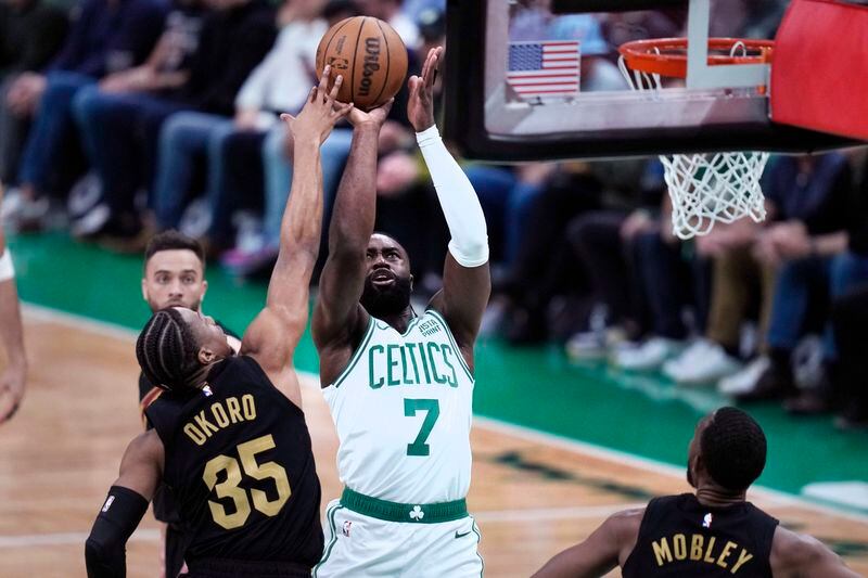Boston Celtics guard Jaylen Brown (7) shoots against Cleveland Cavaliers forward Isaac Okoro (35) during the first half of Game 1 of an NBA basketball second-round playoff series Tuesday, May 7, 2024, in Boston. (AP Photo/Charles Krupa)