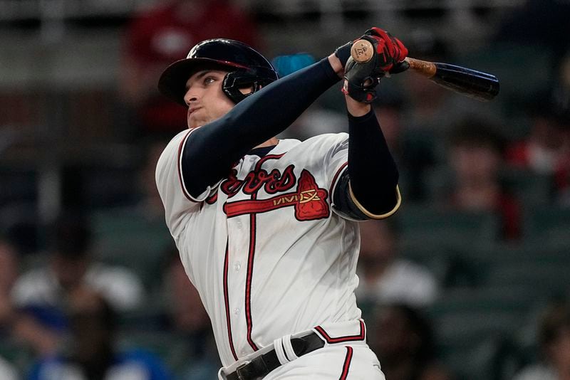 Atlanta Braves' Austin Riley watches his solo home run during the fifth inning of the team's baseball game against the Philadelphia Phillies, Thursday, May 25, 2023, in Atlanta. (AP Photo/John Bazemore)