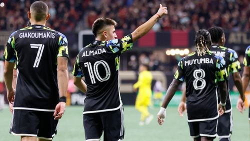 Atlanta United midfielder Thiago Almada (10)thumps up the crowd after scoring during the second half against Columbus Crew in Game 2 of a first-round MLS playoff game at Mercedes-Benz Stadium on Tuesday, Nov. 7, 2023.  Miguel Martinez / miguel.martinezjimenez@ajc.com