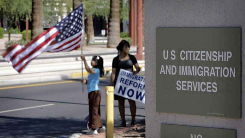 Protesters push for immigration reform in Phoenix. AP Photo/Matt York