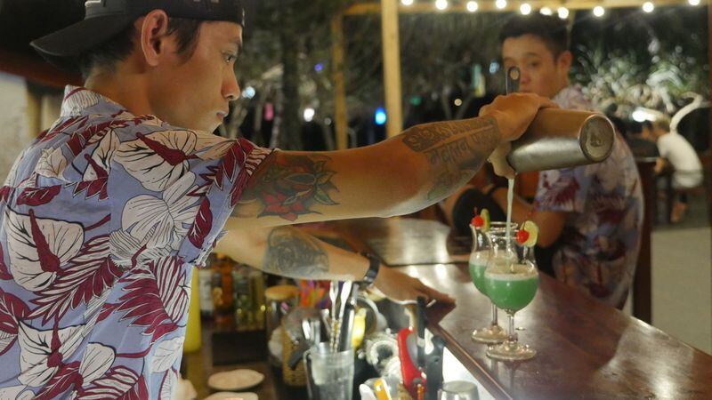 A bartender mixes a cocktail at the Sunset Beach bar on the Vietnamese island of Phu Quoc. (Mark Kurlyandchik/Detroit Free Press/TNS)