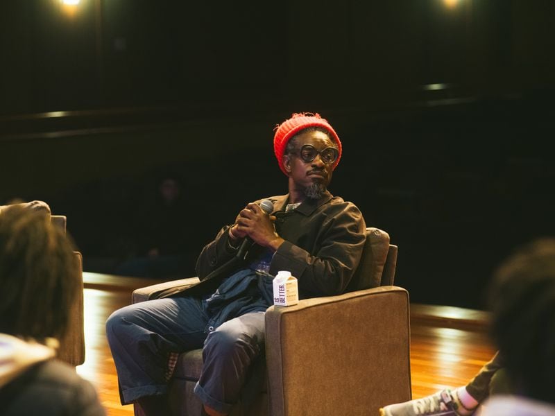 Andre 3000 listens to a question posed by artist Fahamu Pecou during at the Ray Charles Performing Arts Center.