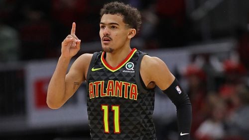 Trae Young  of the Atlanta Hawks celebrates hitting a three point shot against the Chicago Bulls at the United Center on January 23, 2019 in Chicago, Illinois. The Hawks defeated the Bulls 121-101.