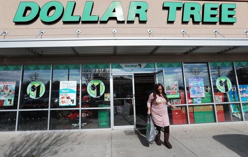 A customer leaves the Dollar Tree at the intersection of Covington Highway and DeKalb Medical Parkway, where three different brand dollar stores are located in a half-mile radius. Curtis Compton/ccompton@ajc.com