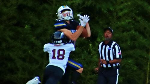 Chamblee High School's Levi Bradham makes a nice catch against Towers High during the 2022 season opener. The DeKalb County School District moved weekend games up to Thursday evening in anticipation of bad weather from Ian. (File photo)