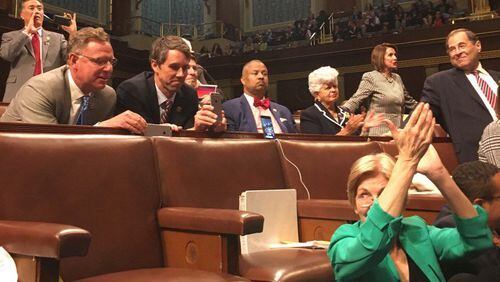 US Rep. Elizabeth Esty posted this photo of tweeting from the House chamber.