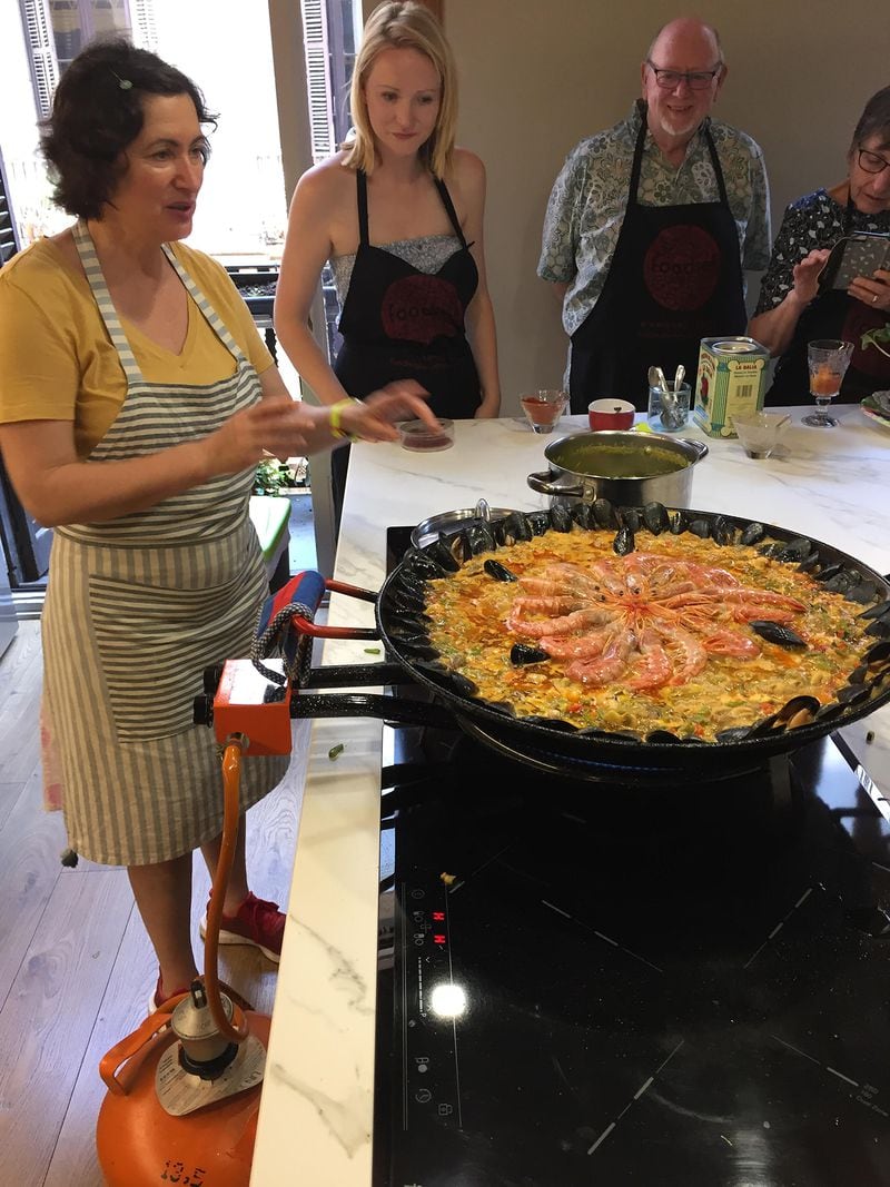An instructor known as Angeles teaches visitors in Barcelona, Spain, how to make paella mixta, which includes chicken and seafood along with a lot of vegetables. (Courtesy of Jenny Robb King)