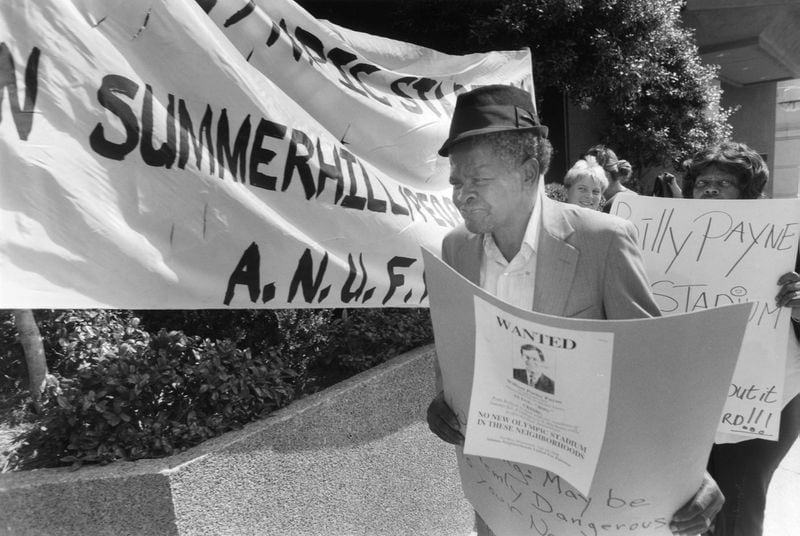 Joseph Render of Summerhill community protests outside the Ritz Carlton Hotel on April 29, 1991. (Walter Stricklin/AJC staff)