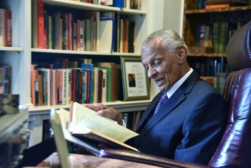 July 25, 2017 Atlanta - C.T. Vivian reads out his favorite poem, "If We Must Die," by Claude McKay at his home library on Tuesday, July 25, 2017. The National Monuments Foundation will be acquiring and managing his world-class library. The collection will be housed in the new Cook Park in Vine City. The 6,000 volume C.T. Vivian Library is one of the most impressive private collections in the city. HYOSUB SHIN / HSHIN@AJC.COM