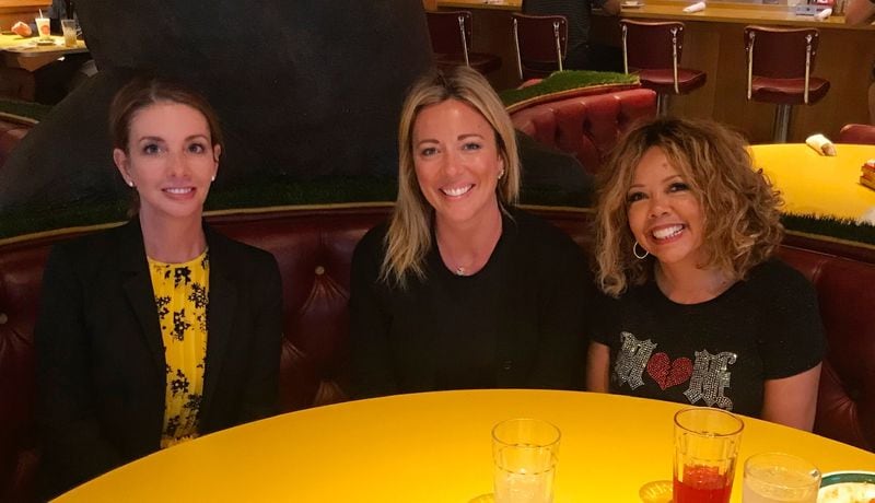 Shannon Watts, who founded Mom's Demand Action for Gun Sense in America, Brooke Baldwin and House Rep. Lucy McBath while Baldwin was researching her book "Huddle." CONTRIBUTED