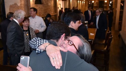 Paige Havens of Go Gwinnett gets a hug from Mason Havens after they found out Gwinnett County’s MARTA referendum failed during an election night watch party at Slow Pour Brewing Company in Lawrenceville on Tuesday, March 19, 2019. HYOSUB SHIN / HSHIN@AJC.COM