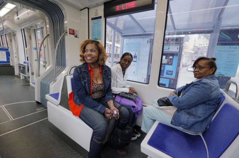 Angela Gilliard (from left), Janet Darthard and Janice Gregory, visiting from Oklahoma City, were excited to ride the Atlanta Streetcar and get an overview of the historic sites along the route recently. Ridership on the streetcar fell 58 percent in 2016 after the city began charging to ride. BOB ANDRES /BANDRES@AJC.COM