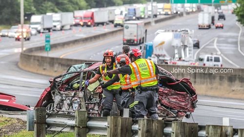 A mangled vehicle was on the scene of a crash investigation that shut down I-285 East for hours Wednesday morning in College Park.