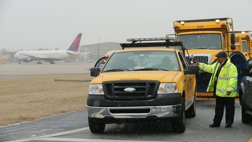 JOHN SPINK / JSPINK@AJC.COM A scene from Hartsfield-Jackson International Airport in 2014 as snow began to fall.