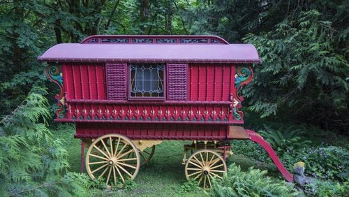 A yellow undercarriage with spoked wheels supports this 13-foot-long Ledge wagon, which Denise Harris built by hand using drawings from the book Making Model Gypsy Caravans. (Steve Ringman/Seattle Times/TNS)
