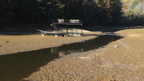 A boat dock sits on the bottom of a cove in Young Deer Creek at Lake Lanier from drought conditions on Nov. 17 near Cumming. Curtis Compton/ccompton@ajc.com