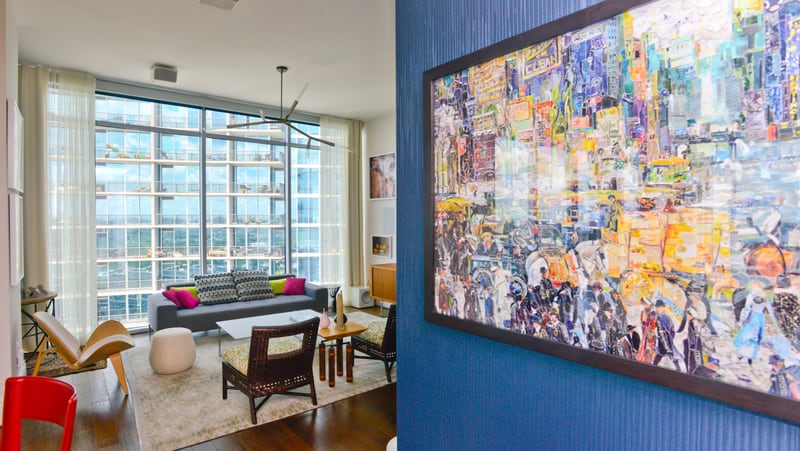 A textured blue wallpaper sets Stephen Wells' entry apart from the rest of his Midtown condo and creates a striking background to showcase his art collection, such as a piece by Vik Muniz. To read more about Wells' home, click here. Text by Lori Johnston and Keith Still/Fast Copy News Service.