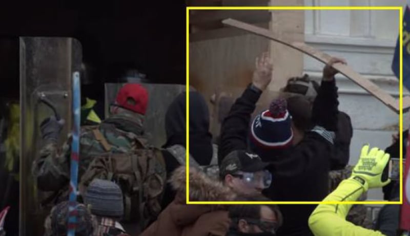 Federal investigators say Jacob Davis, 31 of Adairsville, was among the rioters on Jan. 6, 2021, who fought police in the tunnel on the U.S. Capitol's lower west terrace. This photo allegedly shows Davis throwing a board at police as they blocked the tunnel entrance. 
