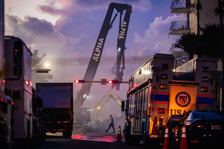 Members of the Miami-Dade Fire Rescue team and excavation crews work to remove debris and continue the search efforts at the Champlain South Towers in Surfside, Fla., on Saturday, June 26, 2021. (Scott McIntyre/The New York Times)