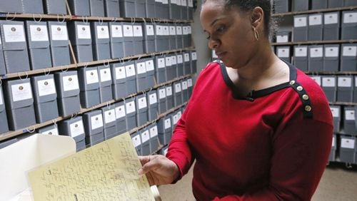 Jan. 6 - Atlanta - Andrea Jackson, head of the Archives Research Center, looks through King’s Nobel Peace Prize acceptance speech. A decade ago, the city nd business leaders scraped together $30 million to buy the King Papers and keep them in Atlanta. The papers, more than 13,000 pages, now reside in a library at Morehouse College, King’s alma mata. BOB ANDRES / BANDRES@AJC.COM