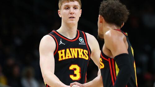 Hawks guard Kevin Huerter gets five from Trae Young after hitting a three against the Indiana Pacers in a NBA basketball game on Tuesday, Feb. 8, 2022, in Atlanta.  “Curtis Compton / Curtis.Compton@ajc.com”