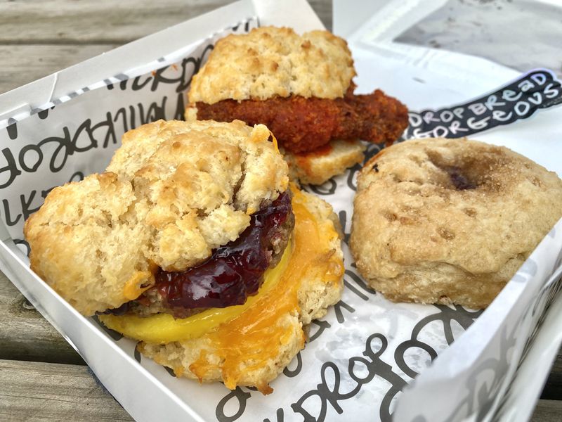 Milkdrop Biscuits offers a changing menu of creative biscuits. Recent items have included (clockwise from left): the Not Your Mamma's Sausage, Hot'lanta sandwich and jam-filled Pop Drop. Ligaya Figueras/ligaya.figueras@ajc.com