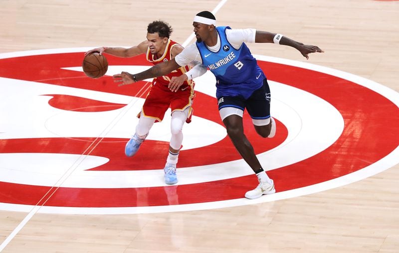 Hawks guard Trae Young draws a foul from Milwaukee Bucks forward Bobby Portis during the second quarter of Game 3 of the Eastern Conference finals Sunday, June 27, 2021, in Atlanta. (Curtis Compton / Curtis.Compton@ajc.com)