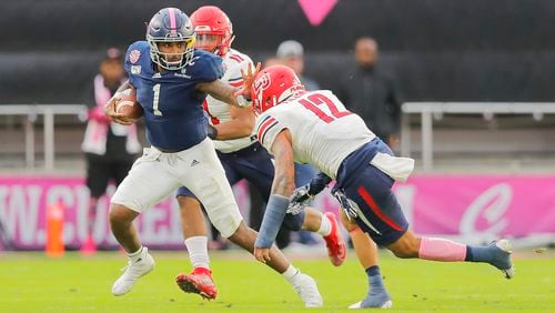 Georgia Soutthern's Shai Werts runs with the ball against Liberty's Brandon Tillmon (12) during the second quarter of the 2019 Cure Bowl Saturday, Dec. 21, 2019, at Exploria Stadium in Orlando, Fla.