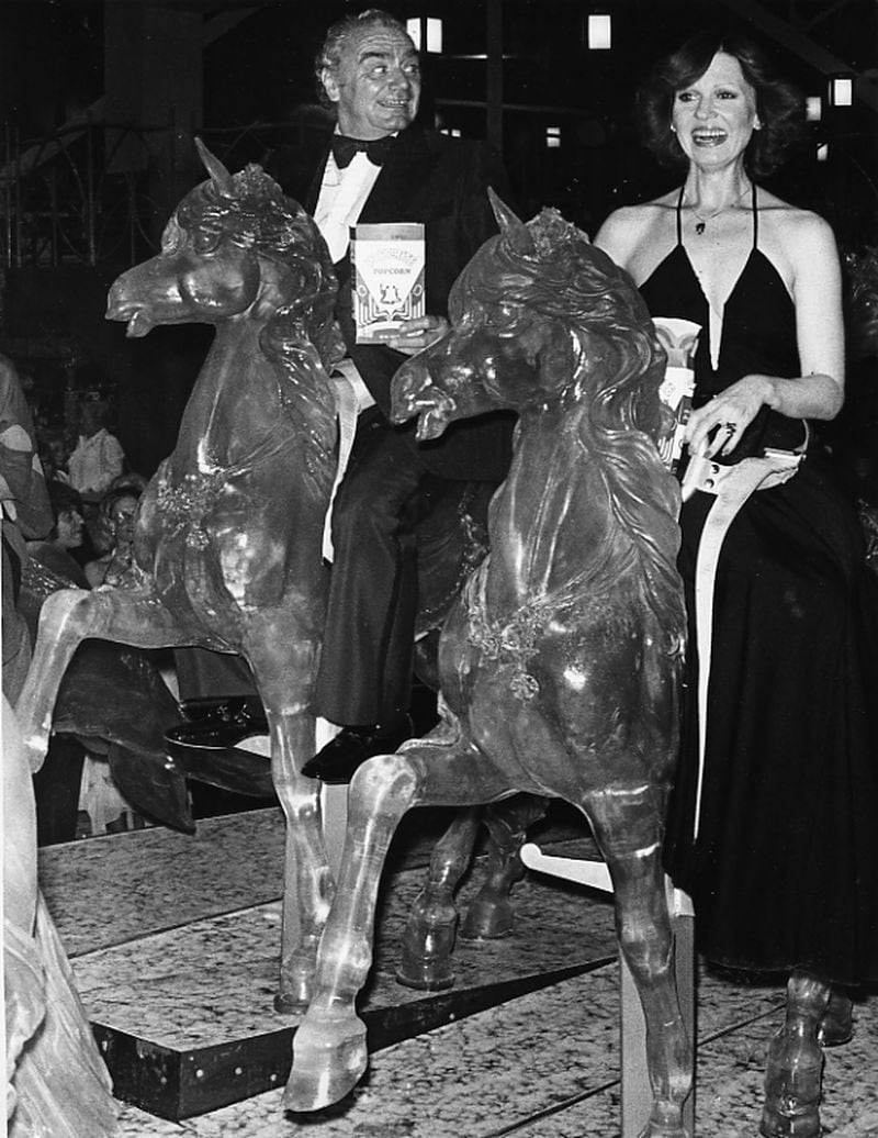 Mrs. & Mrs. Earnest Borgnine on the merry-go-round at the World of Sid & Marty Krofft at the Omni. May 24, 1978. (Calvin Cruce / AJC staff)