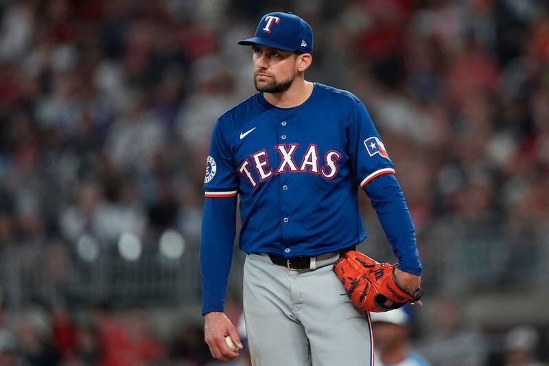 Texas Rangers pitcher Nathan Eovaldi waits on the mound to be relieved in the sixth inning of a baseball game against the Atlanta Braves Saturday, April 20, 2024, in Atlanta. (AP Photo/John Bazemore)
