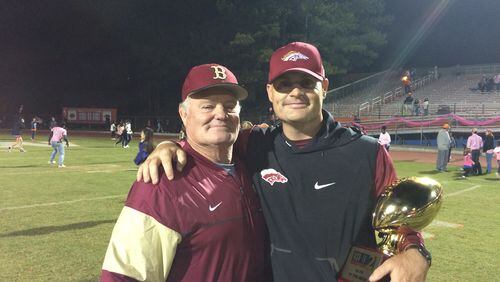 Brookwood coach Philip Jones (right) celebrates the win over Parkview with his father, former Brookwood assistant Tom Jones.