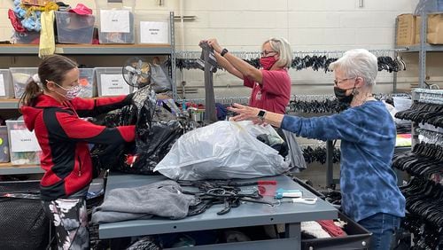 Volunteers at North Fulton Community Charities continue efforts to keep the thrift store and food pantry well stocked for families in need. (Courtesy North Fulton Community Charities)