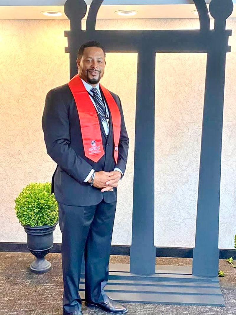 Former Fulton County employee Calvin Brock, in an August 2020 photo posted on Facebook by his boss, Commissioner Natalie Hall. She was congratulating him on completing some certification. At the time, Brock had a tracker on his car placed by Hall, court documents show. Days after this photo was taken, he was fired.