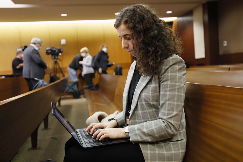 Reporter Tamar Hallerman in the courtroom during the hearing on one of the most anticipated decisions in one of the biggest cases ever to land in Fulton County Superior Court. (Miguel Martinez / miguel.martinezjimenez@ajc.com)