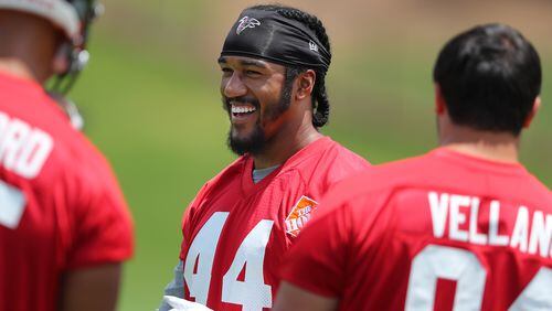 Falcons pass rusher Vic Beasley Jr. shares a laugh with teammates taking the field for the first day of mini-camp on Tuesday, June 13, 2017, in Flowery Branch.     Curtis Compton/ccompton@ajc.com