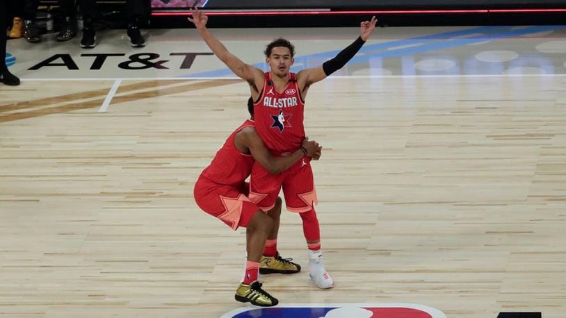 Trae Young of the Hawks celebrates after making a three-point basket during the NBA All-Star game on Feb. 16, 2020, in Chicago. (AP Photo/David Banks)