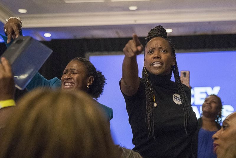 Actress Erika Alexander (right), shown dancing with Democratic supporters during a Stacey Abrams election night watch party on Nov. 7, 2018, is a producer of the new documentary “John Lewis: Good Trouble.” ALYSSA POINTER/ALYSSA.POINTER@AJC.COM