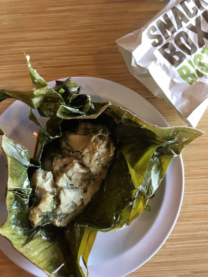 Snackboxe Bistro steams whitefish with dill and lemongrass inside of banana leaves for mok pha. CONTRIBUTED BY WYATT WILLIAMS