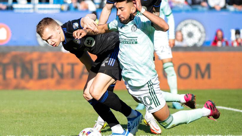 CF Montreal's Alistair Johnston, left, challenges Atlanta United's Marcelino Moreno during the second half of an MLS soccer game in Montreal, Saturday, April 30, 2022. (Graham Hughes/The Canadian Press via AP)